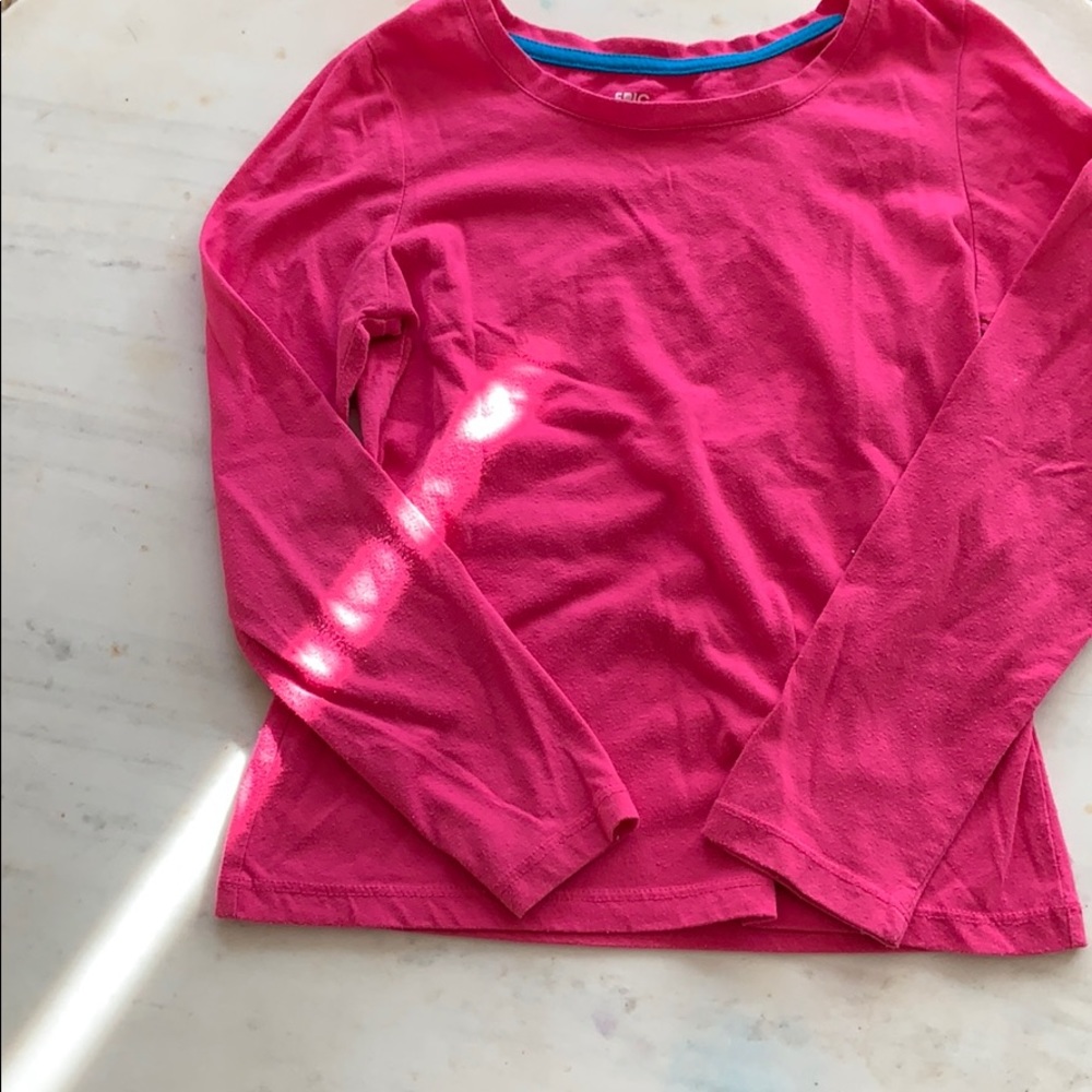 Hot pink plane shirt with some blue at the top